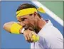  ?? Dylan Buell / Getty Images ?? Rafael Nadal walks across the court against Borna Coric during the Western & Southern Open on Aug. 17 in Mason, Ohio.