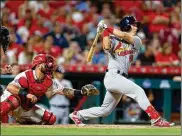  ?? KIRK IRWIN / GETTY IMAGES ?? St. Louis Cardinals rookie Tommy Edman hits a grand slam during the sixth inning of the game against the Reds in Cincinnati on Thursday. Edman’s homer off reliever Robert Stephenson was his fourth of the season and snapped a 3-3 tie.