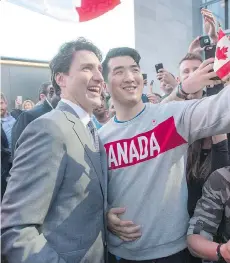  ?? RYAN REMIORZ/ THE CANADIAN PRESS ?? Prime Minister Justin Trudeau poses for photos with staff as he leaves the Salesforce office Thursday in San Francisco. Trudeau is hoping to boost the tech industry in Canada.