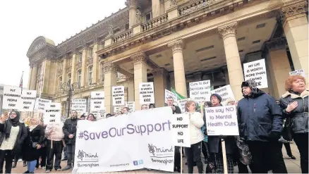  ??  ?? > Hundreds of people staged a protest against cuts outside the Council House this week