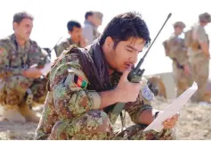  ?? — Reuters ?? An Afghan Tactical Air Controller practices directing an air strike during an exercise at a range outside Kabul.