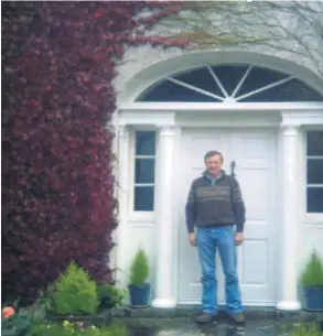  ?? ?? Ned O’Farrell standing at the front door of his granduncle Tim Hennessy’s Ahabeg ‘great house’. This estate was Tim’s inheritanc­e. Tim Hennessy left it all behind to die for Ireland. I wish to thank Mr and Mrs Ned and Bridget O’Farrell, for giving so much family history for this article and a guided tour of this amazing historic house.