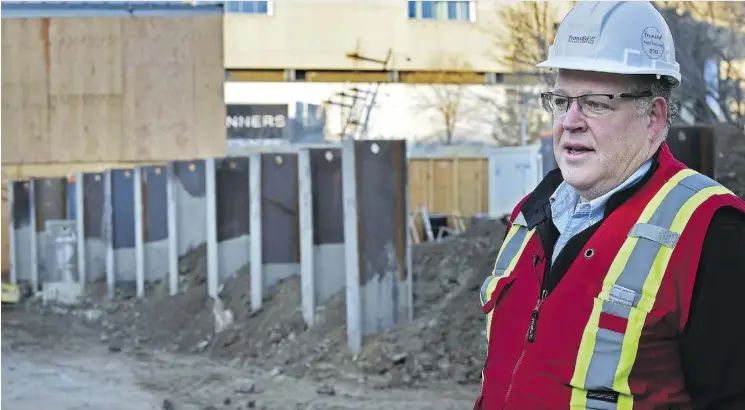  ?? ED KAISER ?? Next to piles being installed in Churchill Square, TransEd spokespers­on Dean Heuman provides an update on the Valley Line LRT constructi­on activities completed this year.