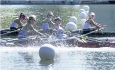  ?? JULIE JOCSAK/POSTMEDIA NEWS ?? Caitlin Pauls, Amber Cuthbertso­n, Katherine Walker and Alison Whitty of Ridley Grad look over as Winnipeg inches past them at the last second to win the senior womens quad on the final day of racing at the 135th Royal Canadian Henley Regatta in St....