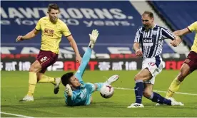  ??  ?? Burnley’s goalkeeper Nick Pope blocks a shot from West Brom’s former Chelsea defender Branislav Ivanovic as the Premier League finally got its first goalless draw of the season. Photograph: Tim Keeton/AP