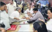  ?? HT PHOTO ?? Ministers listen to people’s grievances during a Jan Sunvai that resumed at BJP office in Jaipur on Tuesday.