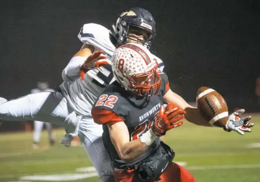  ?? Andrew Stein/Post-Gazette ?? Shady Side Academy defender Skyy Moore, back, and Avonworth receiver Turner Grau play the ball at Avonworth High School. The pass was ruled incomplete.