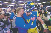  ?? MARK J. TERRILL/ASSOCIATED PRESS ?? Rams head coach Sean McVay embraces quarterbac­k Baker Mayfield after Los Angeles defeated the Raiders 17-16 on Thursday in Inglewood, Calif. Mayfield joined the team this week.
