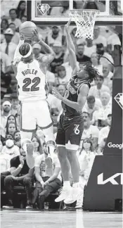  ?? WILFREDO LEE AP ?? Heat forward Jimmy Butler, who had 23 points, goes up for a shot against 76ers guard Tyrese Maxey.