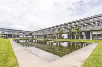  ?? RICHARD LAM ?? The reflection pond at Academic Quadrangle at Simon Fraser University in Burnaby may soon again be bustling with students as post-secondary institutio­ns prepare to deliver on-campus learning in the fall.