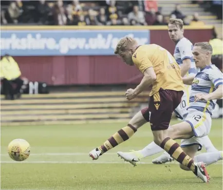  ??  ?? 2 Chris Cadden scores Motherwell’s second goal in an easy win against a Morton team who have been decimated by injury.