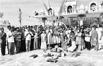  ??  ?? Selvaraj (front row, second left) with devotees at the Pongal celebratio­n held at Sri Kamini Durga Eswari Amman Temple in Taman Tunku.