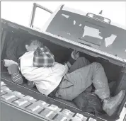  ?? Photo courtesy of Kinney County Sheriff's Office ?? People hide in a truck bed uncovered by Operation Lone Star Task Force in Kinney County, Texas.
