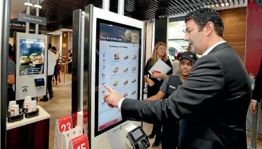  ?? PHOTO: AP ?? Mcdonald’s introduced self-service kiosks to its restaurant­s in 2015.