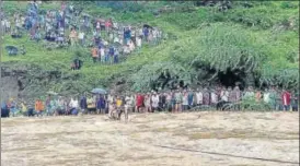  ?? PTI/HT PHOTO ?? Rescue work under way after a jeep was swept away in Kherwada area, Udaipur, in Rajasthan on Monday. (Below) A family is rescued from a flooded locality in Ahmedabad, Guajarat.