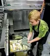  ?? PHOTO: DAVID UNWIN/STUFF ?? Connor Gilmour, 8, puts spring rolls in the oven.