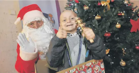  ??  ?? Bradley Lowery with Father Christmas.