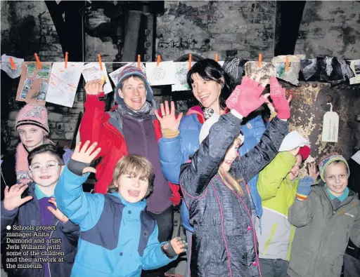  ??  ?? ● Schools project manager Anita Daimond and artist Jwls Williams with some of the children and their artwork at the museum