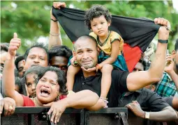  ?? — PTI ?? (clockwise) Supporters, in large numbers, arrive to pay their last respects to DMK chief M. Karunanidh­i at Rajaji Hall in Chennai on Wednesday. Prime Minister Narendra Modi pays his last respects to DMK chief Karunanidh­i. Supporters mourn as they wait...