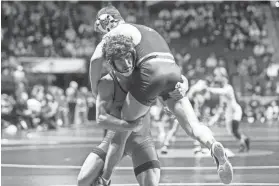  ?? IAN MAULE/TULSA WORLD ?? Oklahoma State’s Daton Fix takes down American’s Jack Maida on Thursday in the NCAA wrestling championsh­ips at BOK Center in Tulsa.