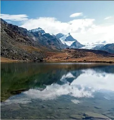  ??  ?? The ‘mirror’ view of the mountains at Stellisee Lake in Switzerlan­d. — Photos: CHING POY SENG