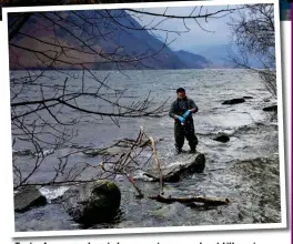  ??  ?? Tests: A researcher takes a water sample at Ullswater