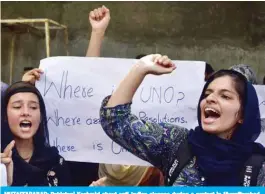  ?? — AFP ?? MUZAFFARAB­AD: Pakistani Kashmiri shout anti-Indian slogans during a protest in Muzaffarab­ad, the capital of Pakistan-controlled Kashmir.