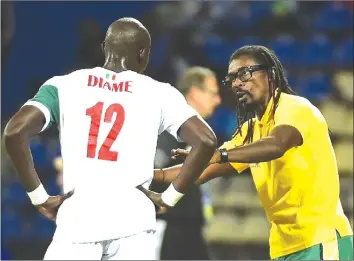  ??  ?? LIONS OF TERANGA . . . Senegal’s head coach Aliou Cisse (right) speaks to midfielder Mohamed Diame during their 2017 African Cup of Nations Group B match against Algeria, in Francevill­e, on January 23. Cisse will be out to plot Cameroon’s downfall in...