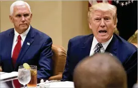  ?? STEPHEN CROWLEY / THE NEW YORK TIMES ?? President Donald Trump, with Vice President Mike Pence at his side, called the latest failure of a GOP plan to repeal and replace Obamacare “disappoint­ing.”
