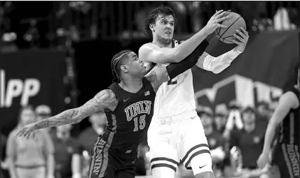  ?? STEVE MARCUS FILE (2023) ?? UNLV guard Luis Rodriguez (15) tries to steal the ball from Boise State forward Tyson Degenhart (2) during the Mountain West tournament March 9, 2023, in Las Vegas.