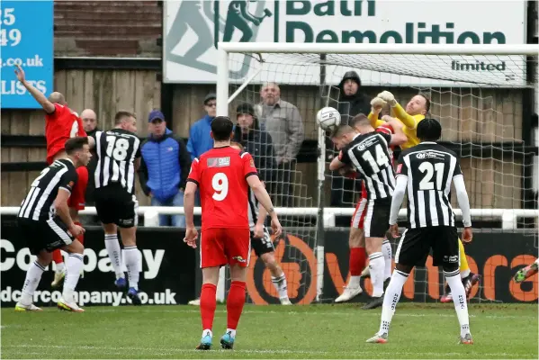  ?? ?? Goalkeeper Ryan Clarke tries to punch a ball away