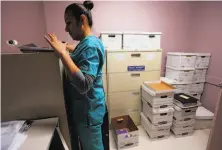  ?? Jennifer Whitney / New York Times ?? Medical assistant Veronica Hernandez closes up at the Whole Women’s Health Clinic in McAllen, Texas.