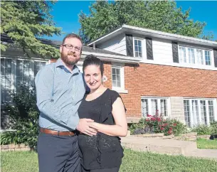  ?? RYAN REMIORZ/THE CANADIAN PRESS ?? Thomas Poirier and Elena Trigiani paid 15 per cent above asking price for their Pointe-Claire home.