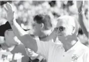  ?? THE OKLAHOMAN ARCHIVE ?? Former Oklahoma State head coach Jim Stanley waves to the crowd after a halftime ceremony on Oct. 28, 2006. Members of the 1976 Cowboys visited Stanley in the hospital on Sunday.