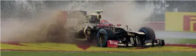  ??  ?? Water, water everywhere for Romain Grosjean as his Lotus E20 aquaplanes during practice for the 2012 British GP. Grosjean topped the timesheets in Friday’s first practice but the rain was so heavy that Silverston­e advised spectators not to travel to the circuit for qualifying on Saturday to save the car parks for raceday spectators