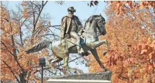  ?? STEVE HELBER, AP ?? Fall leaves frame a statue of Confederat­e Maj. Gen. J.E.B. Stuart on Monument Avenue in Richmond, Va.