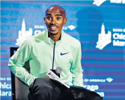  ??  ?? Hitting back: Mo Farah speaks yesterday at a defiant press conference before running in tomorrow’s Chicago Marathon