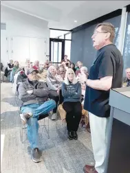  ?? Courtesy Photo ?? Bella Vista Historical Society Co-President Dale Phillips speaks to a crowd about the Dug Hill Cemetery on April 4 at the Bella Vista Public Library.