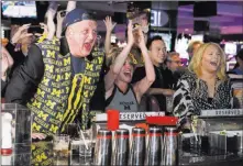  ?? Sam Morris ?? Las Vegas News Bureau Derek Stevens, CEO and co-owner of D Las Vegas, reacts with his wife, Nicole, center, and daughter Whitney while watching alma mater Michigan take on Loyola-chicago on Saturday at the D.