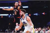  ?? FRANK FRANKLIN II / AP ?? New York Knicks’ Jalen Brunson (11) runs out to defend a shot by Golden State Warriors’ Klay Thompson (11) during the first half of an NBA basketball game on Tuesday in New York.