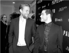  ?? — AFP photos ?? Charlie Hunnam (Left) and Rami Malek attend the premiere of Bleecker Street Media’s ‘Papillon’ atThe LondonWest Hollywood recently inWest Hollywood, California. In limited release, the film launched with just US$1.1 million in 544 locations.