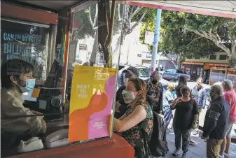  ?? Brontë Wittpenn / The Chronicle ?? Assistant manager Jake Ryan takes tickets as catloving fans enter the Roxie Theater.