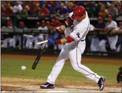  ?? Associated Press ?? Texas Rangers’ A.J. Pierzynski
breaks his bat on a foul ball Thursday during the first inning of a game against the Los Angeles
Angels in Arlington, Texas.