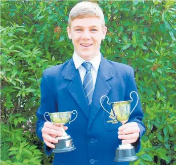  ??  ?? Eaton /Galbraith Cup for Personal Endeavour, Carol Warner Cup for Most Improved Trampolini­st Awardee and Finalist Nominee for Sports Boy and Sherwood Cup, Lachlan Kirk.