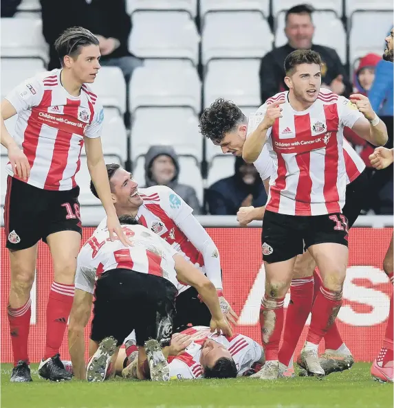  ??  ?? Chris Maguire celebrates his goal against Ipswich Town.