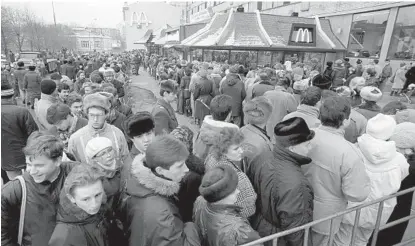  ?? AP FILE ?? Hundreds of people in Moscow line up outside the first McDonald’s restaurant in the Soviet Union on its opening day Jan. 31, 1990. McDonald’s said Thursday that it has begun the process of selling its Russian business.