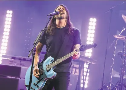  ?? Kevin Winter / Getty Images for iHeartMedi­a ?? Dave Grohl performs with the Foo Fighters last month for a radio broadcast in Burbank.