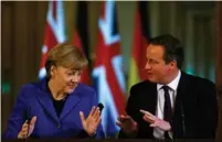  ?? (Reuters) ?? GERMAN CHANCELLOR Angela Merkel speaks at a news conference with British Prime Minister David Cameron at Number 10 Downing Street in London yesterday.
