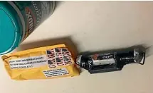  ?? AP ?? This screenshot from CNN’s Twitter account shows what CNN says is the explosive device that was delivered to their New York headquarte­rs. The package contained a live explosive with wires, a black pipe and an envelope with white powder.