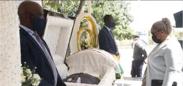  ?? ?? Mashonalan­d West Provincial Affairs and Devolution Minister Mary Mliswa-Chikoka pays her last respects during the body viewing of national hero Engineer Oliver Chidawu in Chinhoyi yesterday. — Picture: Joseph Manditswar­a